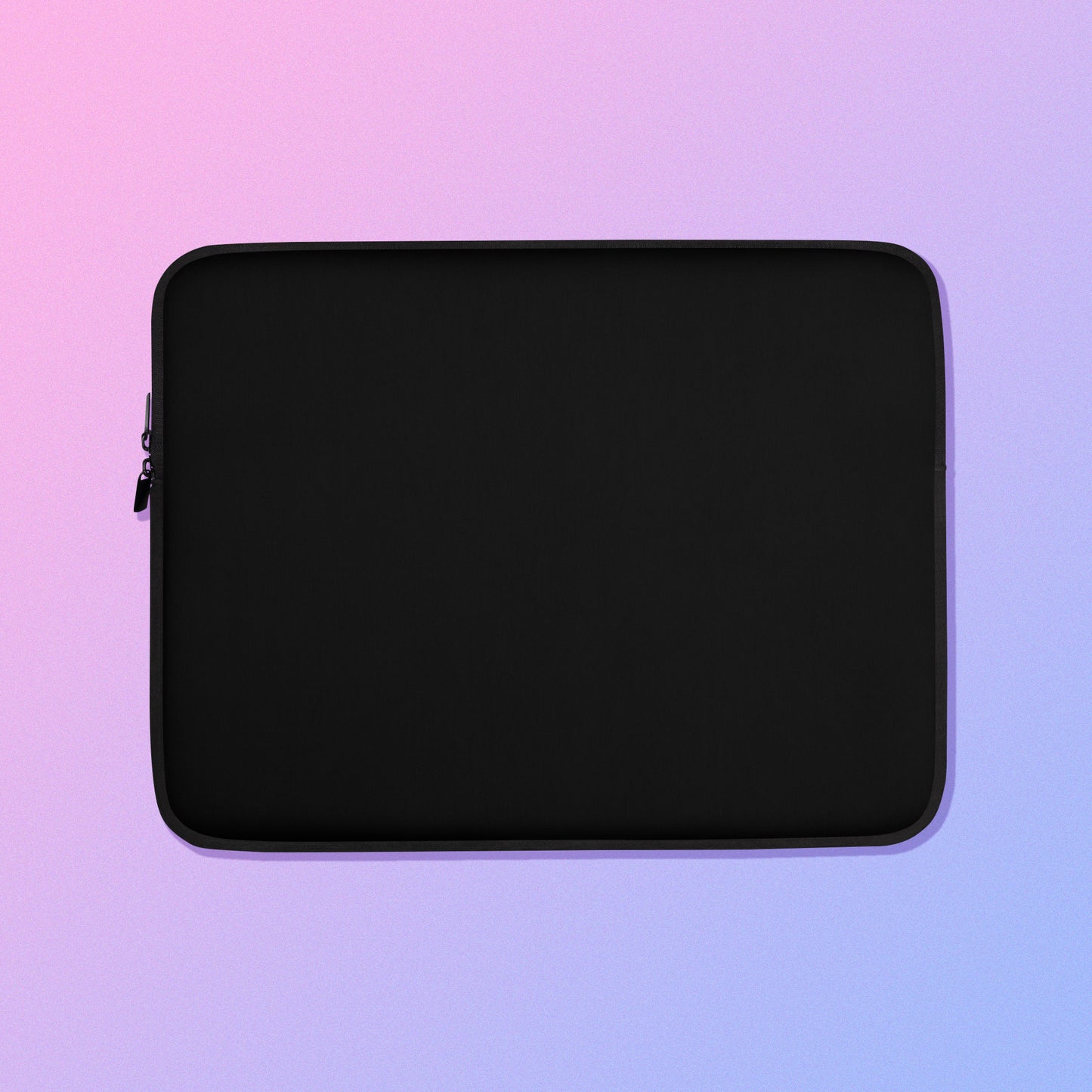 Laptop sleeve with plain black fabric on one side and a pink, purple and blue space-themed galaxy galah cockatoo feather pattern on the other on a pink and purple gradient background.