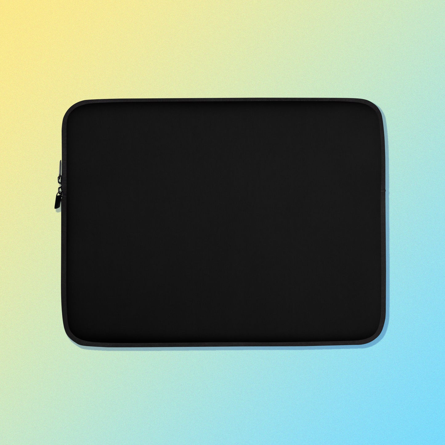 Laptop sleeve with a plain black colour on one side and a colourful purple, blue and yellow satin bowerbird pattern on the other on a yellow and blue gradient background.