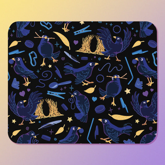 Dark blue-black mouse pad with a colourful satin bowerbird pattern on a gradient background