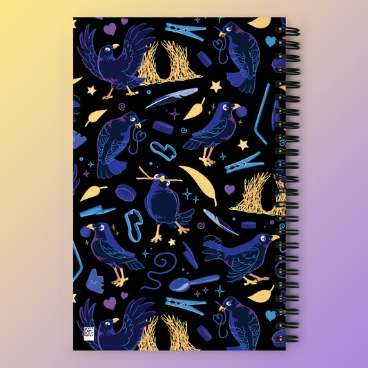 Spiral notebook with a colourful purple, blue and yellow satin bowerbird pattern on a yellow and purple gradient background.