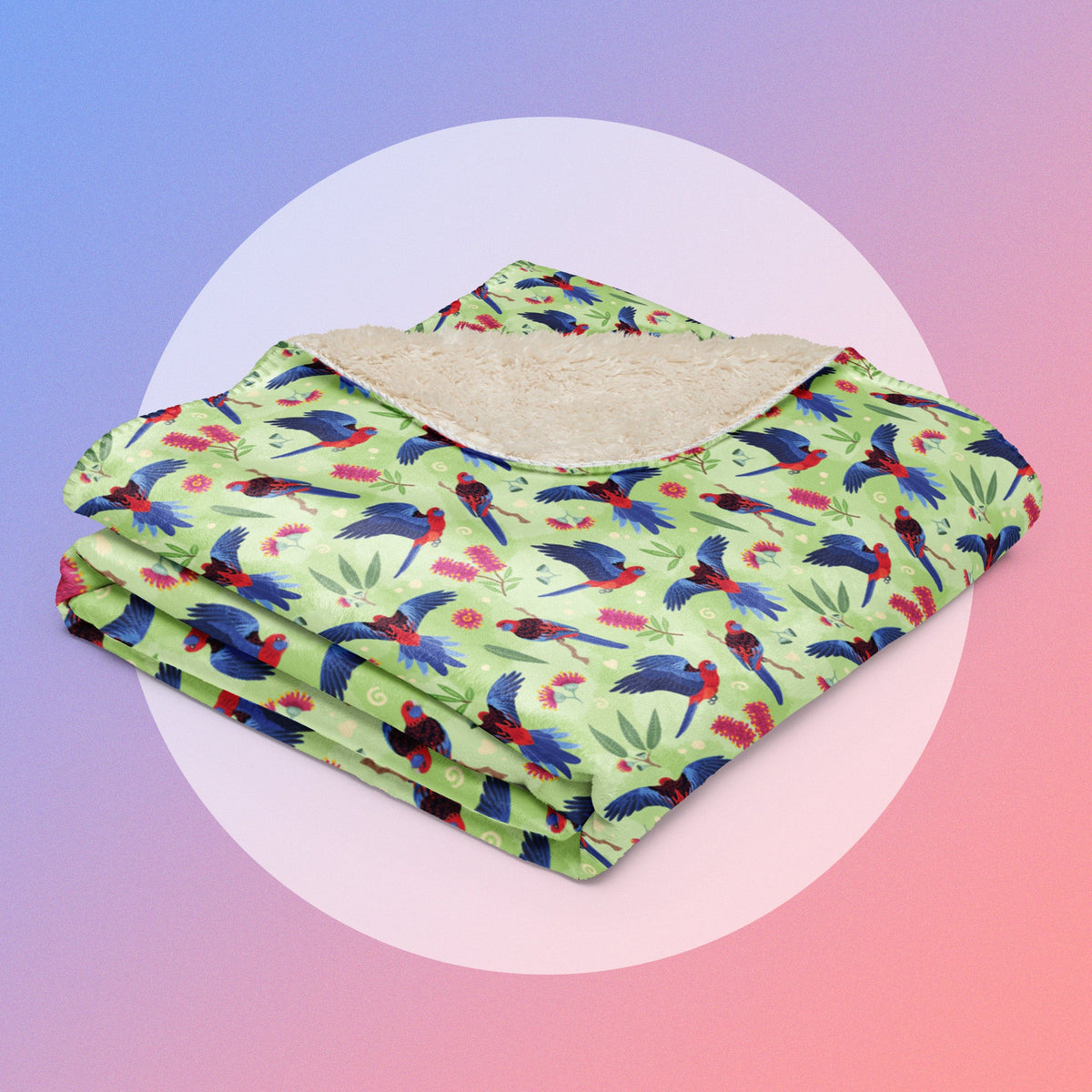A folded crimson rosella pattern blanket on a white circle on a blue and pink gradient background.