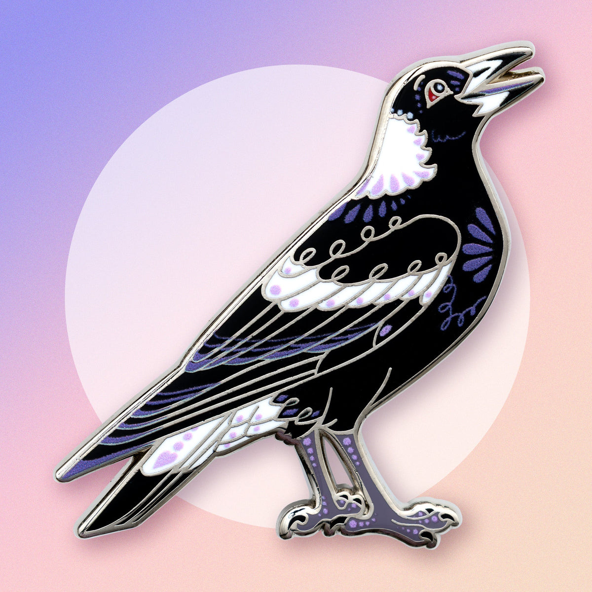 A nickel-plated Australian magpie hard enamel pin on a blue, purple and pink gradient background.