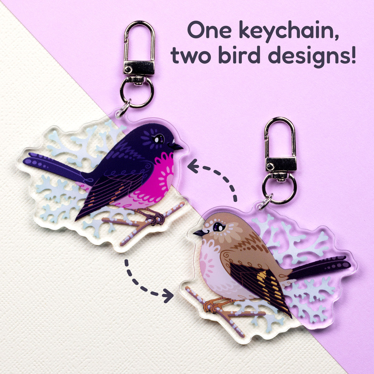Both sides of a double-sided acrylic keychain of male & female pink robins sitting on a split cream and pale lilac background with the text 'One keychain, two bird designs!' in the top right.