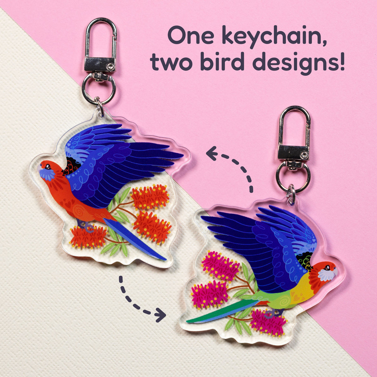 Both sides of a double-sided acrylic keychain of crimson & eastern rosellas sitting on a split cream and pale pink background with the text 'One keychain, two bird designs!' in the top right.