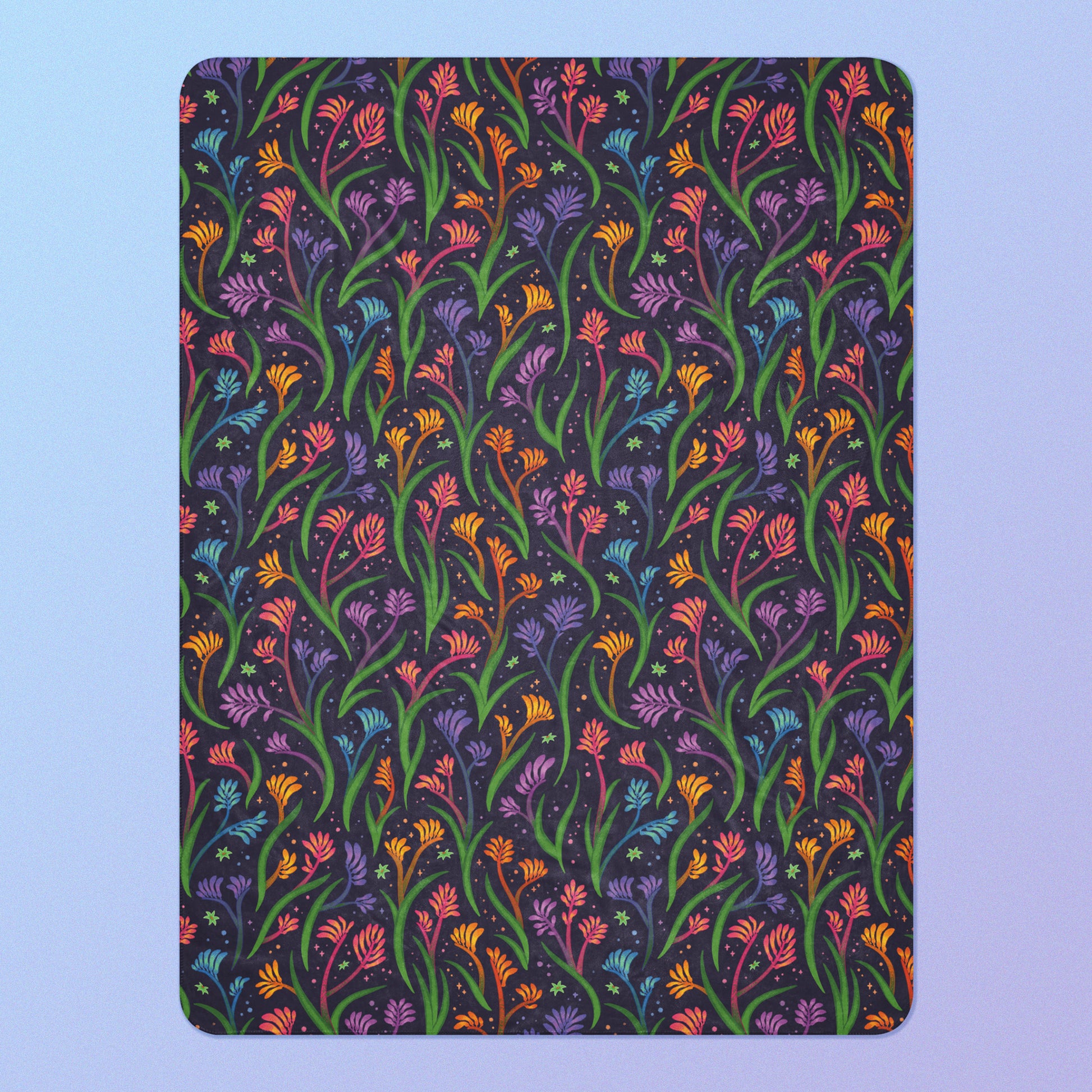 A rainbow kangaroo paw flower pattern blanket on a blue and purple gradient background.