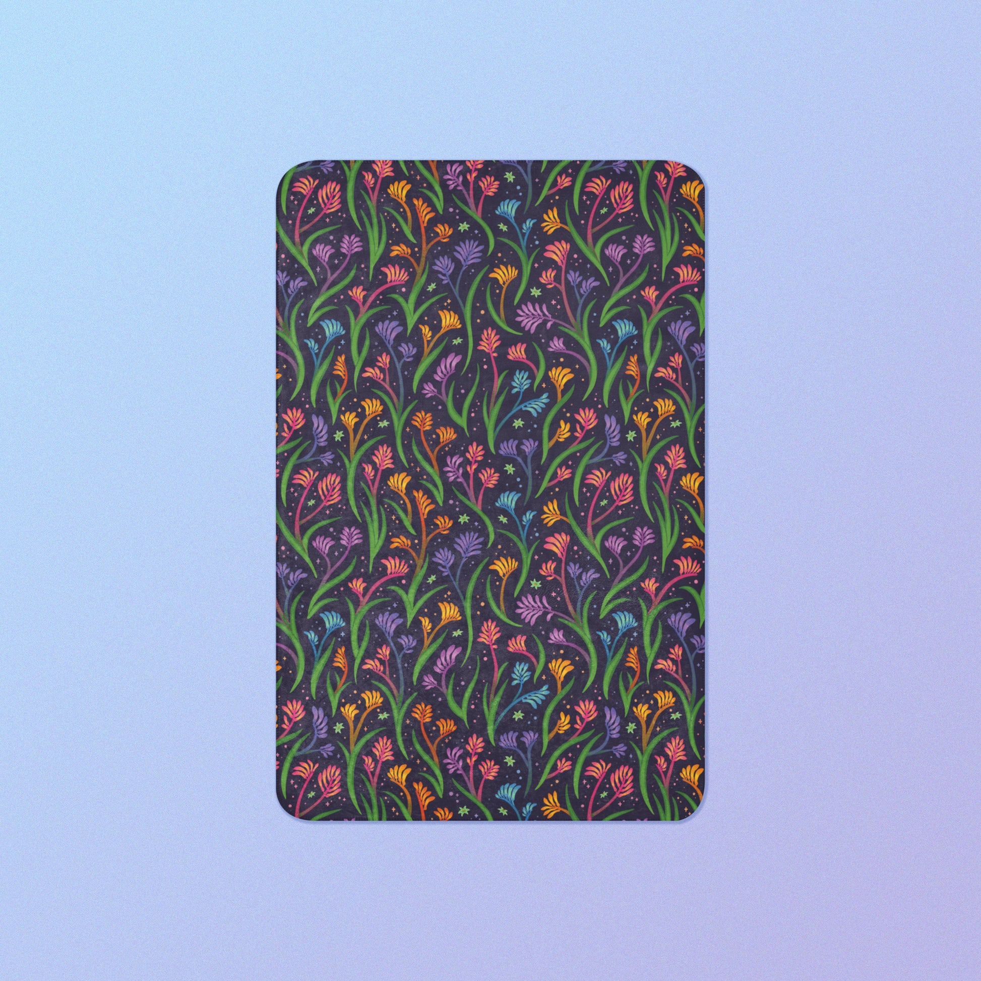 A rainbow kangaroo paw flower pattern blanket on a blue and purple gradient background.