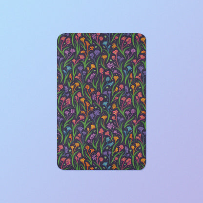 A rainbow kangaroo paw flower pattern blanket on a blue and purple gradient background.