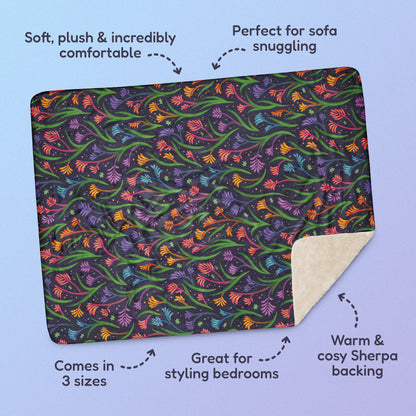 Features & benefits ('Soft, plush & incredibly comfortable', 'Perfect for sofa snuggling', 'Comes in 3 sizes', 'Great for styling bedrooms', 'Warm & cosy Sherpa backing') surrounding a rainbow kangaroo paw flower pattern blanket on a blue and purple gradient background.