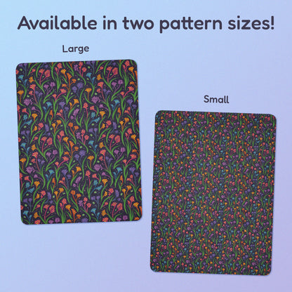 Side-by-side comparison of two pattern print sizes (Large & Small) of a rainbow kangaroo paw flower pattern blanket on a blue and purple gradient background.