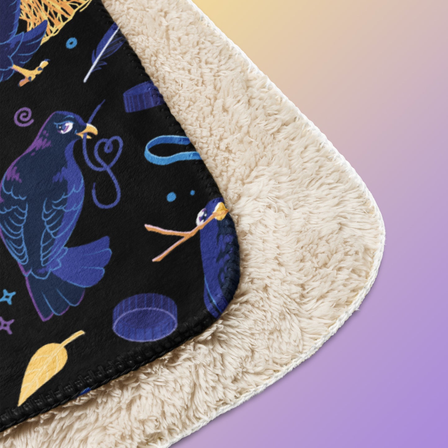 Close up detail of a folded black, blue, purple and yellow male Aussie satin bowerbird pattern blanket on a yellow and purple gradient background.