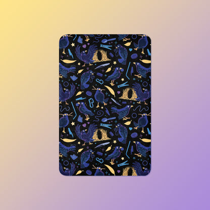 A black, blue, purple and yellow male Aussie satin bowerbird pattern blanket on a yellow and purple gradient background.