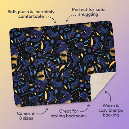 Features & benefits ('Soft, plush & incredibly comfortable', 'Perfect for sofa snuggling', 'Comes in 3 sizes', 'Great for styling bedrooms', 'Warm & cosy Sherpa backing') surrounding a black, blue, purple and yellow male Aussie satin bowerbird pattern blanket on a yellow and purple gradient background.