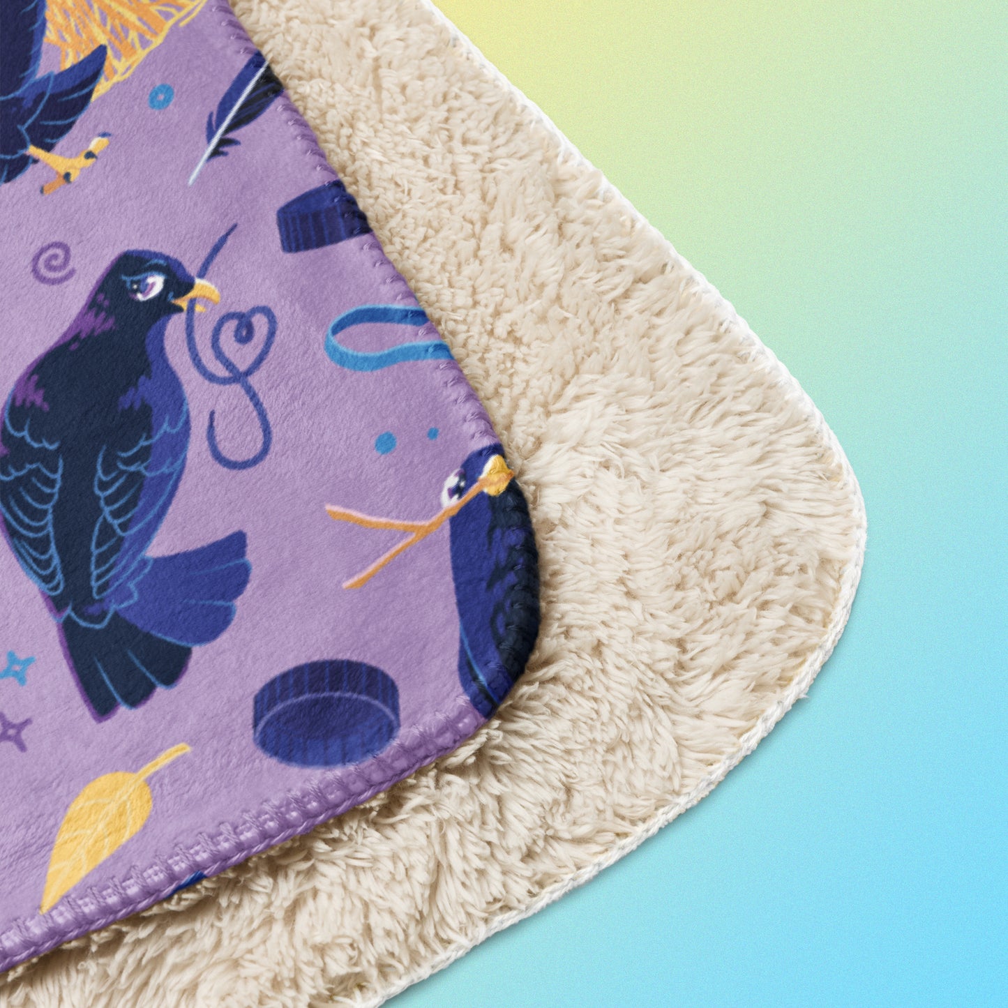 Close up detail of a folded purple, blue and yellow male Aussie satin bowerbird pattern blanket on a yellow and blue gradient background.