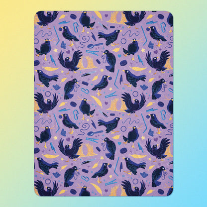 A purple, blue and yellow male Aussie satin bowerbird pattern blanket on a yellow and blue gradient background.