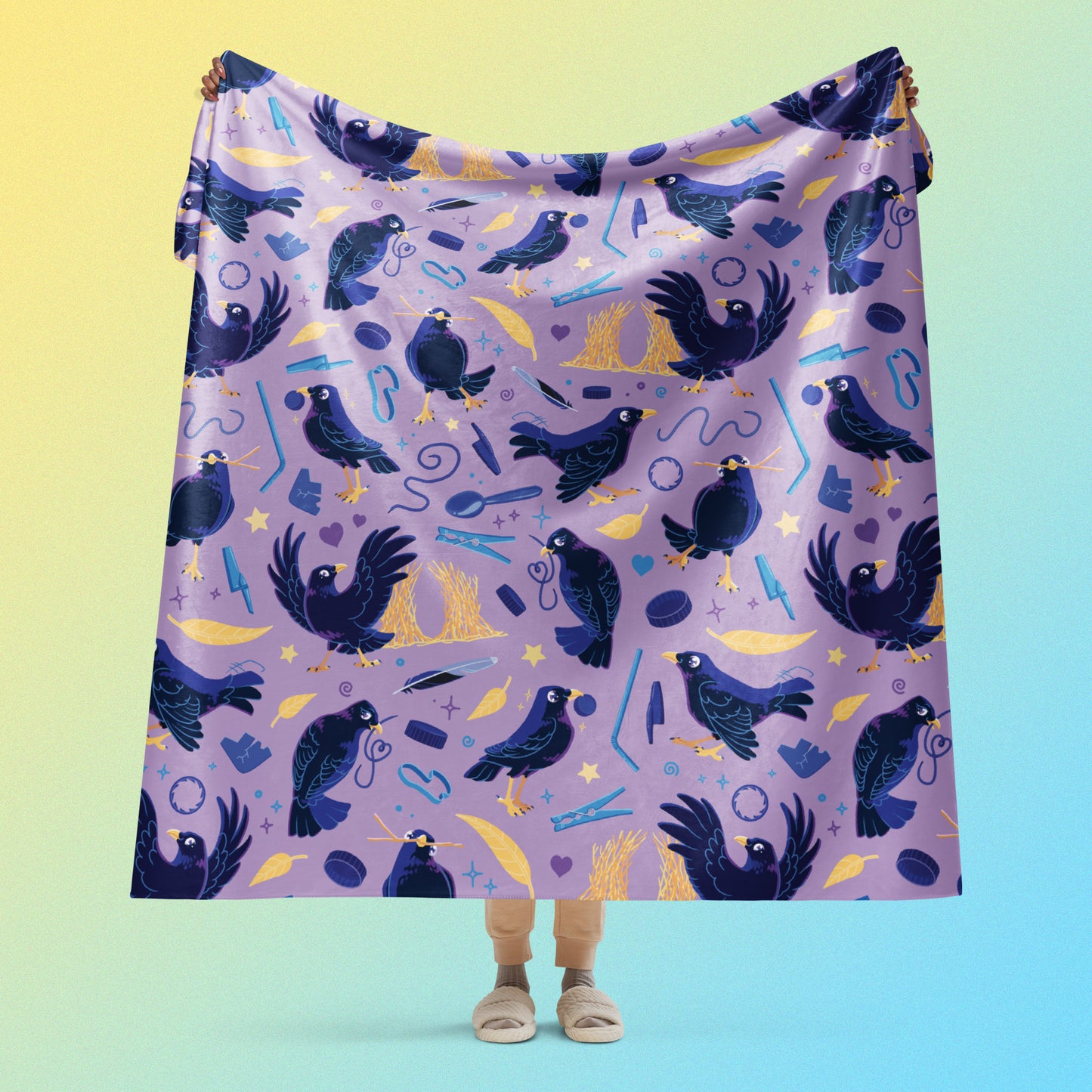 Person holding a purple, blue and yellow male Aussie satin bowerbird pattern blanket above their head on a yellow and blue gradient background.