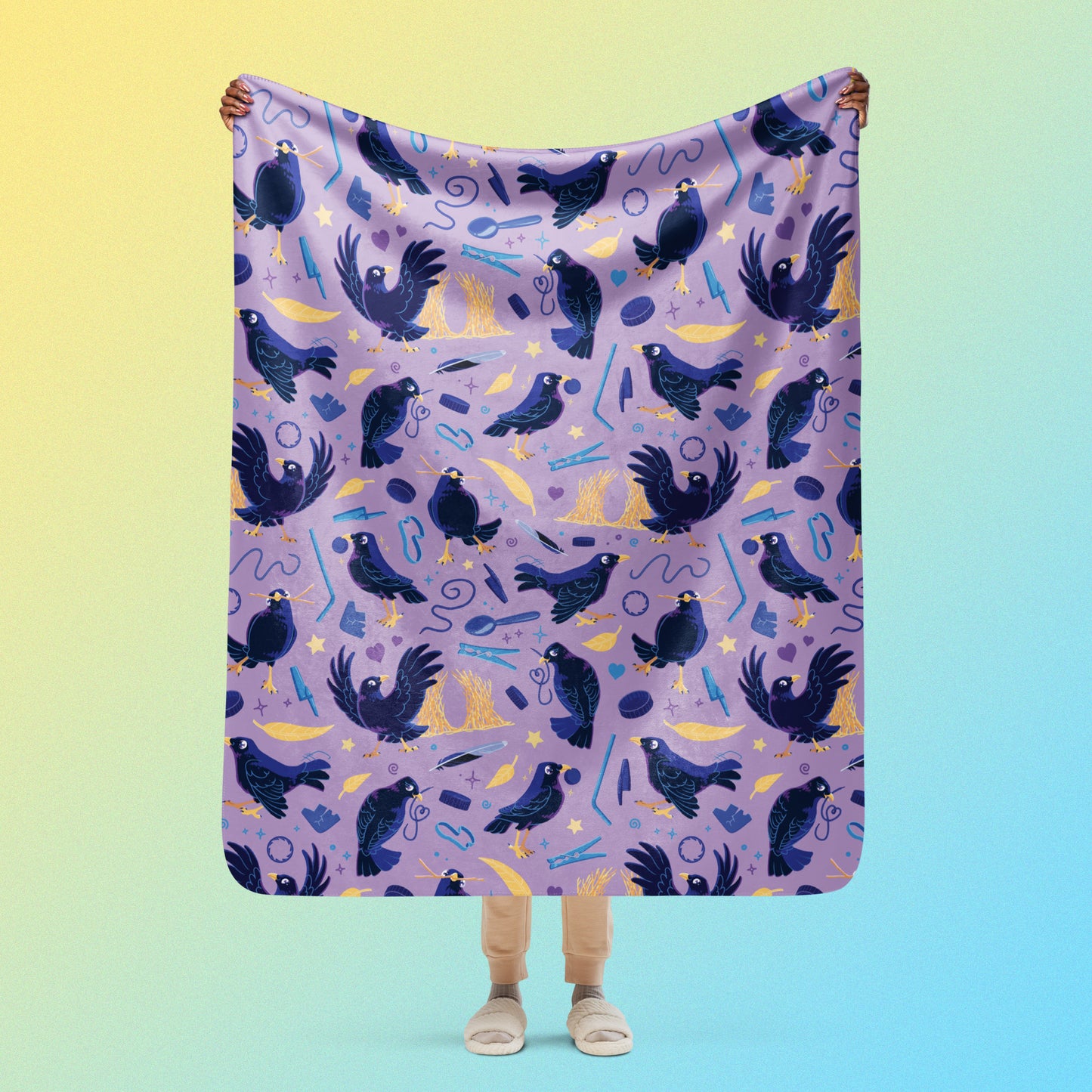 Person holding a purple, blue and yellow male Aussie satin bowerbird pattern blanket above their head on a yellow and blue gradient background.