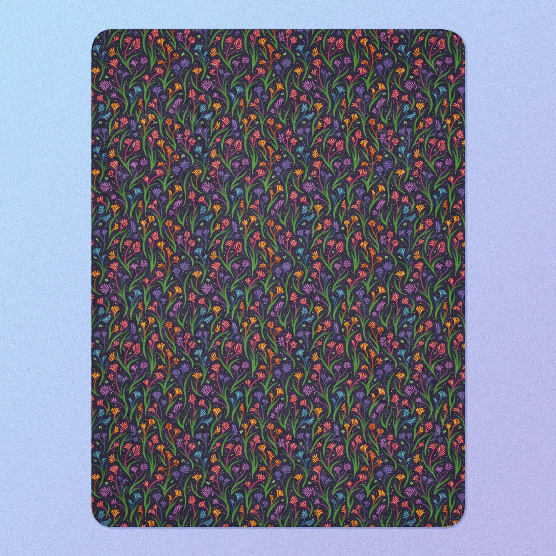 A rainbow kangaroo paw flower pattern blanket on a blue and purple gradient background.