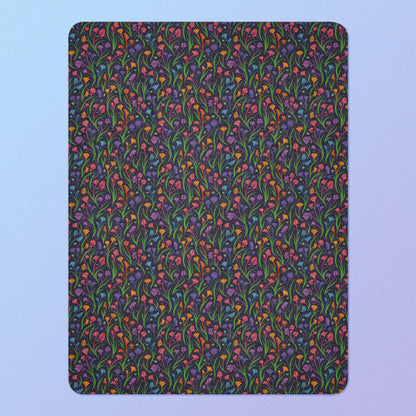 A rainbow kangaroo paw flower pattern blanket on a blue and purple gradient background.