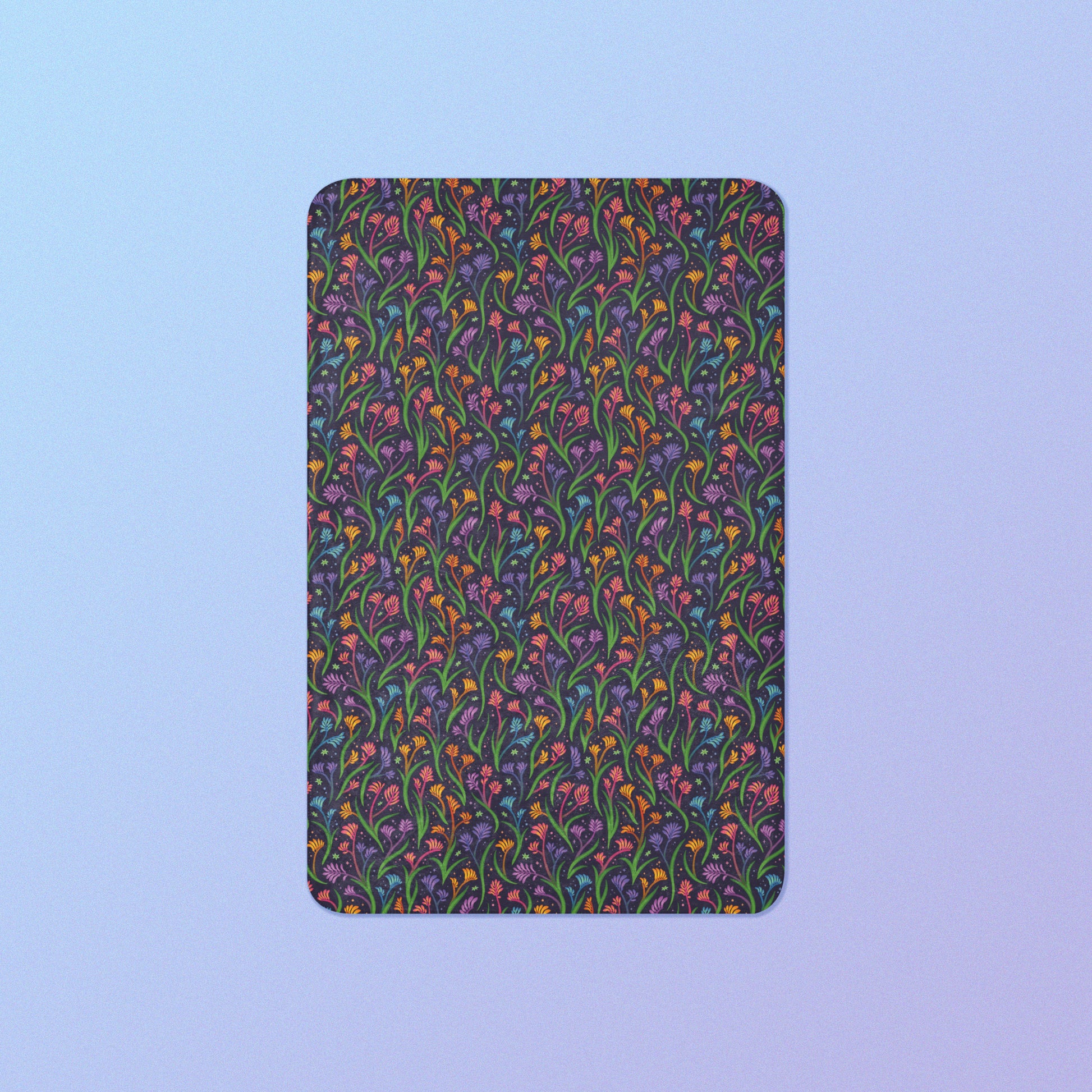 A rainbow kangaroo paw flower pattern blanket on a blue and purple gradient background.