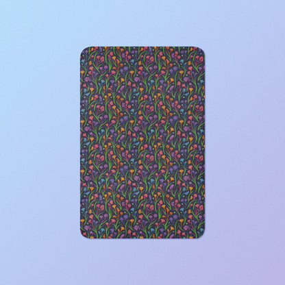 A rainbow kangaroo paw flower pattern blanket on a blue and purple gradient background.