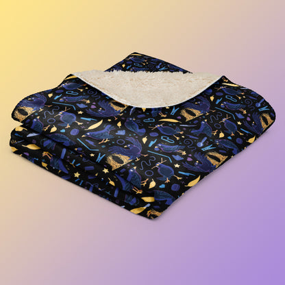 A folded black, blue, purple and yellow male Aussie satin bowerbird pattern blanket on a yellow and purple gradient background.