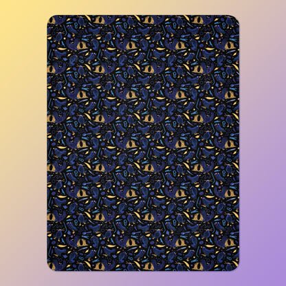 A black, blue, purple and yellow male Aussie satin bowerbird pattern blanket on a yellow and purple gradient background.