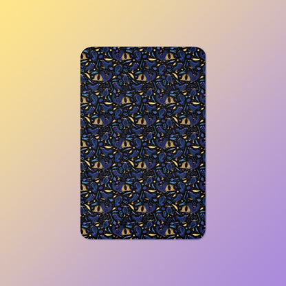 A black, blue, purple and yellow male Aussie satin bowerbird pattern blanket on a yellow and purple gradient background.