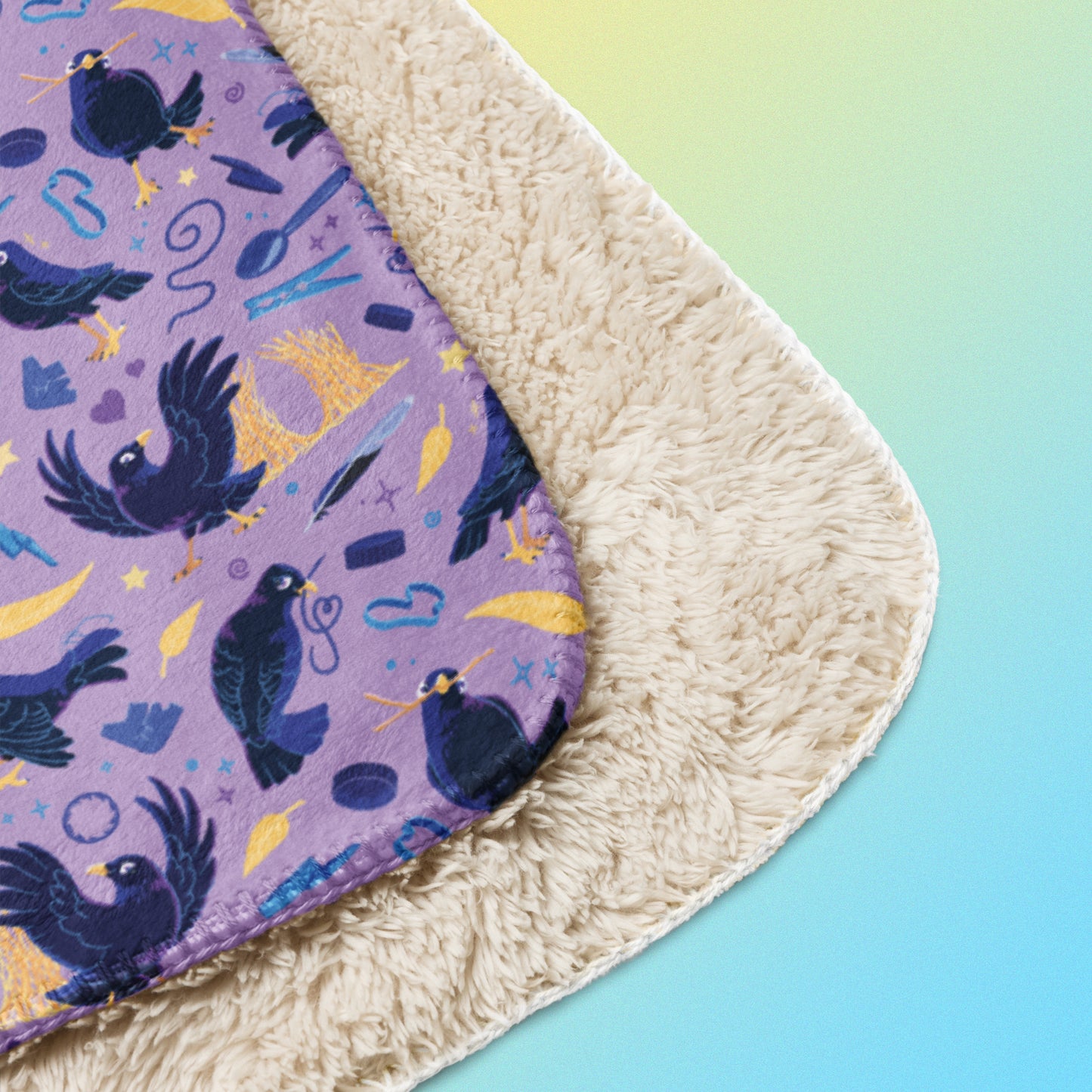 Close up detail of a folded purple, blue and yellow male Aussie satin bowerbird pattern blanket on a yellow and blue gradient background.
