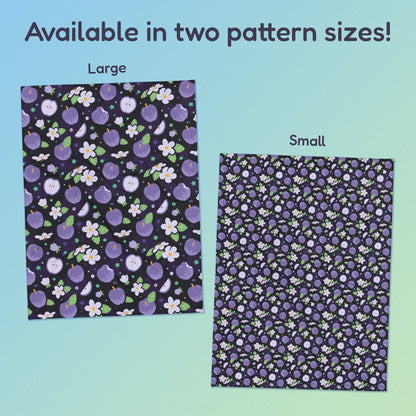 Side-by-side comparison of two pattern print sizes (Large & Small) of a purple apples & blossoms pattern blanket on a blue and green gradient background.