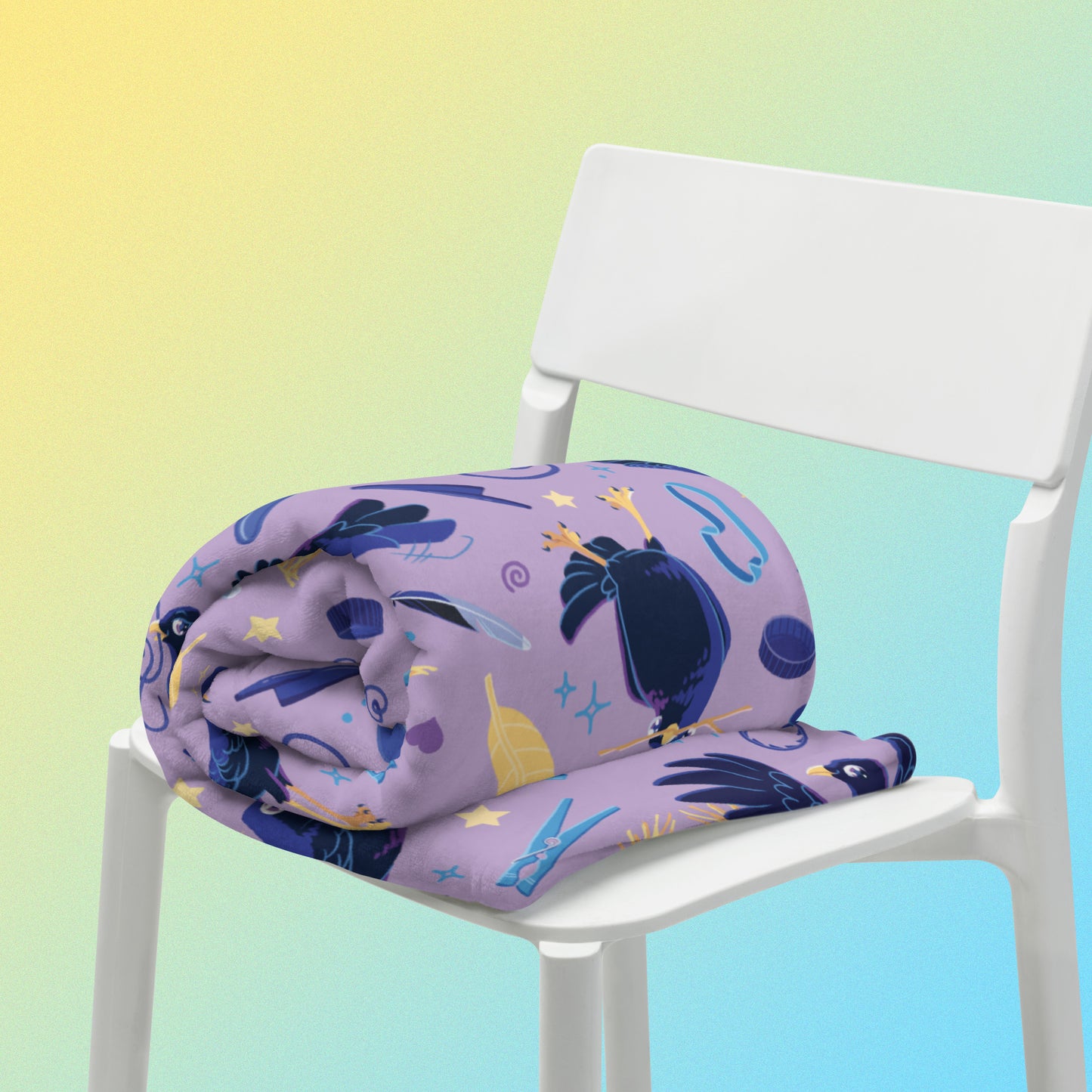 A purple, blue and yellow male Aussie satin bowerbird pattern blanket sitting on a white chair on a yellow and blue gradient background.