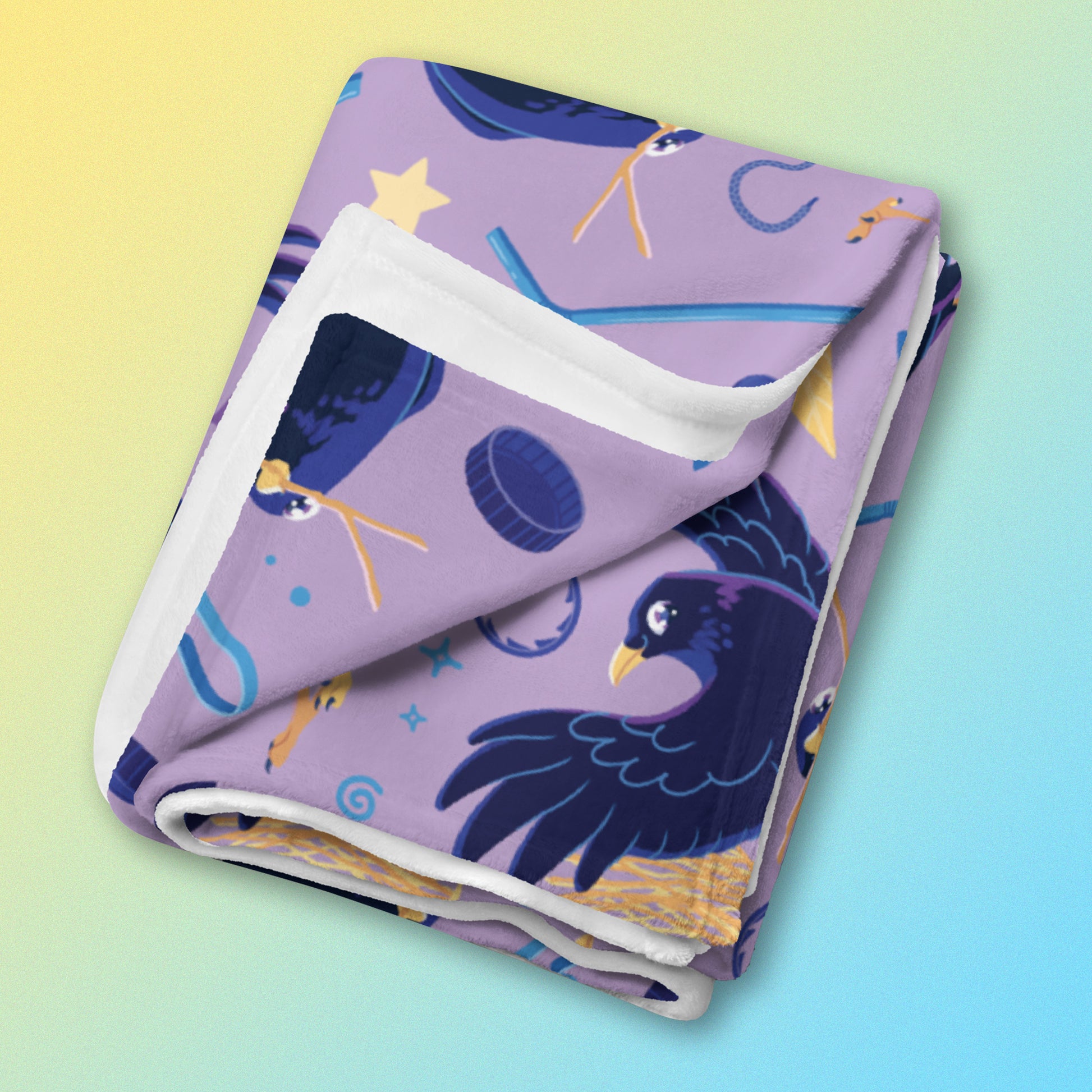 A folded purple, blue and yellow male Aussie satin bowerbird pattern blanket on a yellow and blue gradient background.