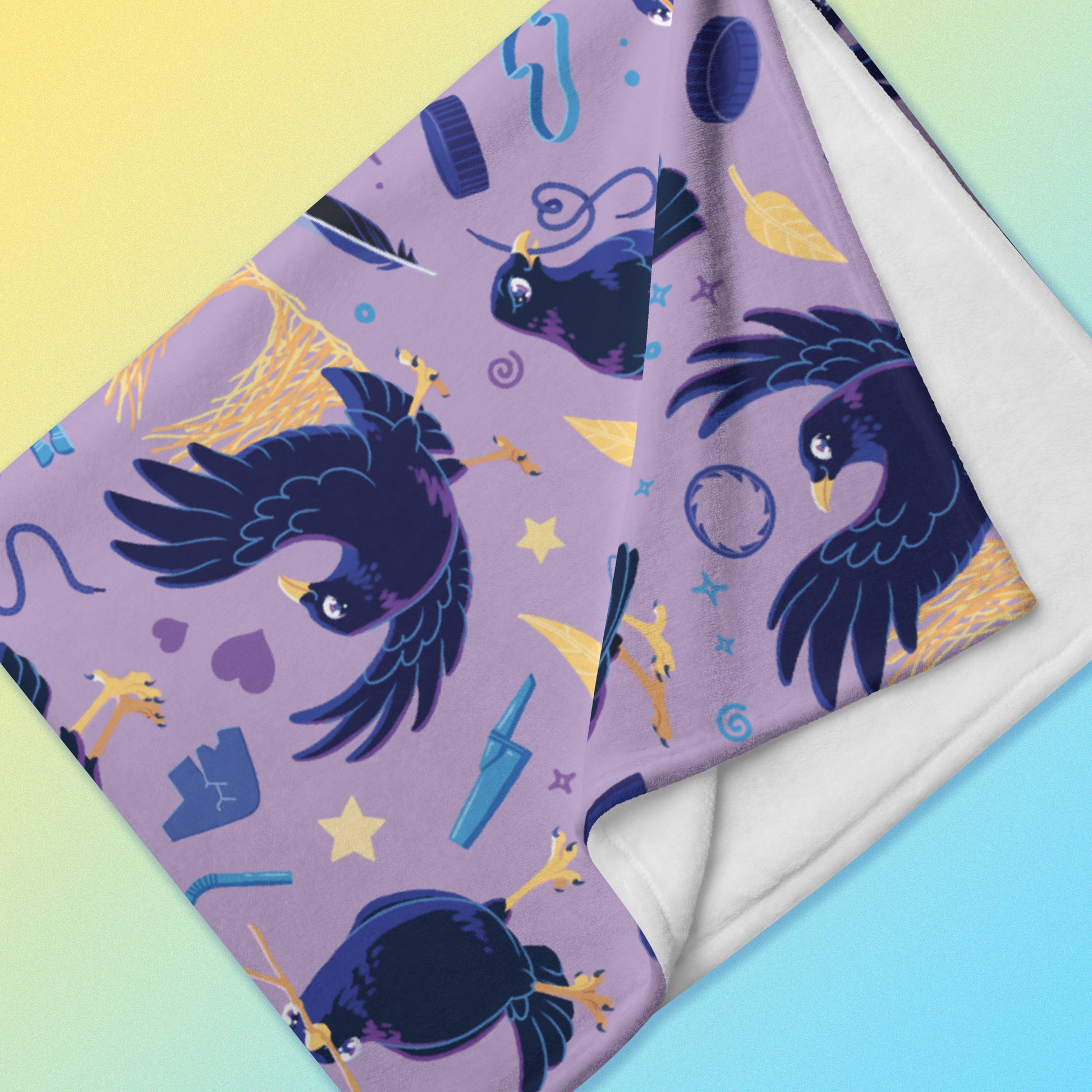 Detailed close up of a folded purple, blue and yellow male Aussie satin bowerbird pattern blanket on a yellow and blue gradient background.
