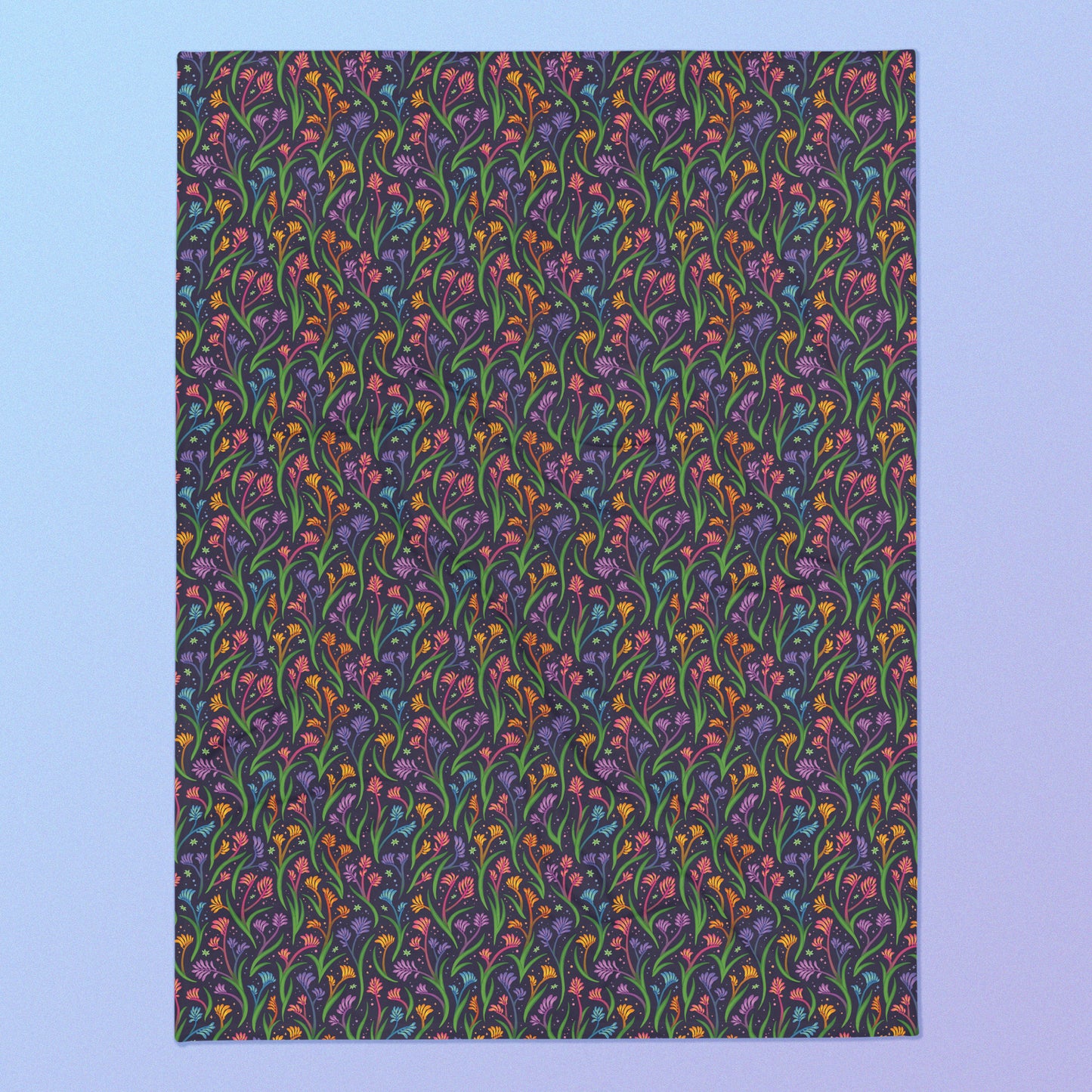 A rainbow kangaroo paw flower pattern blanket on a blue and purple gradient background.
