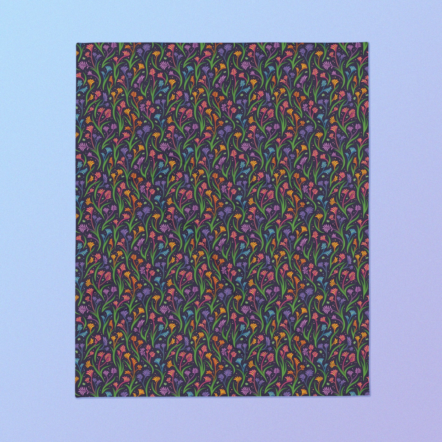 A rainbow kangaroo paw flower pattern blanket on a blue and purple gradient background.