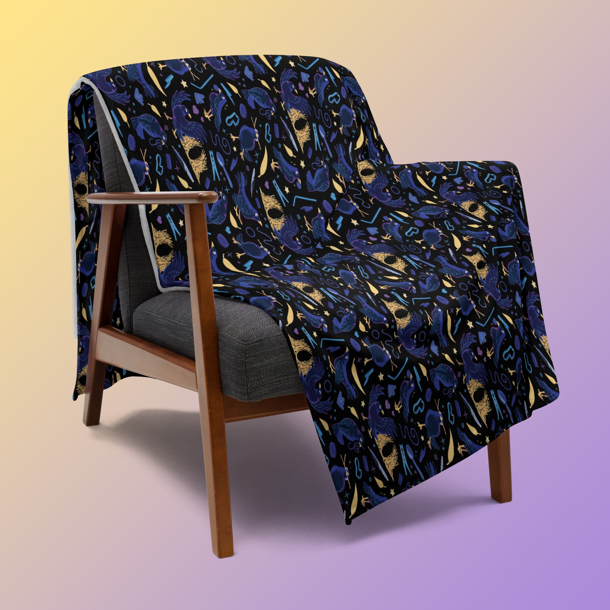 A black, blue, purple and yellow male Aussie satin bowerbird pattern blanket draped over a wooden chair on a yellow and purple gradient background.