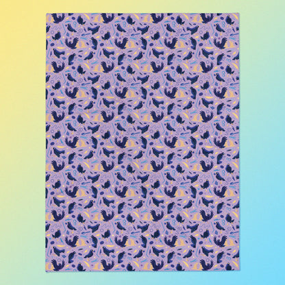 A purple, blue and yellow male Aussie satin bowerbird pattern blanket on a yellow and blue gradient background.