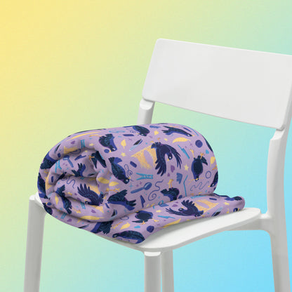 A purple, blue and yellow male Aussie satin bowerbird pattern blanket sitting on a white chair on a yellow and blue gradient background.