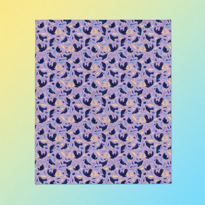 A purple, blue and yellow male Aussie satin bowerbird pattern blanket on a yellow and blue gradient background.