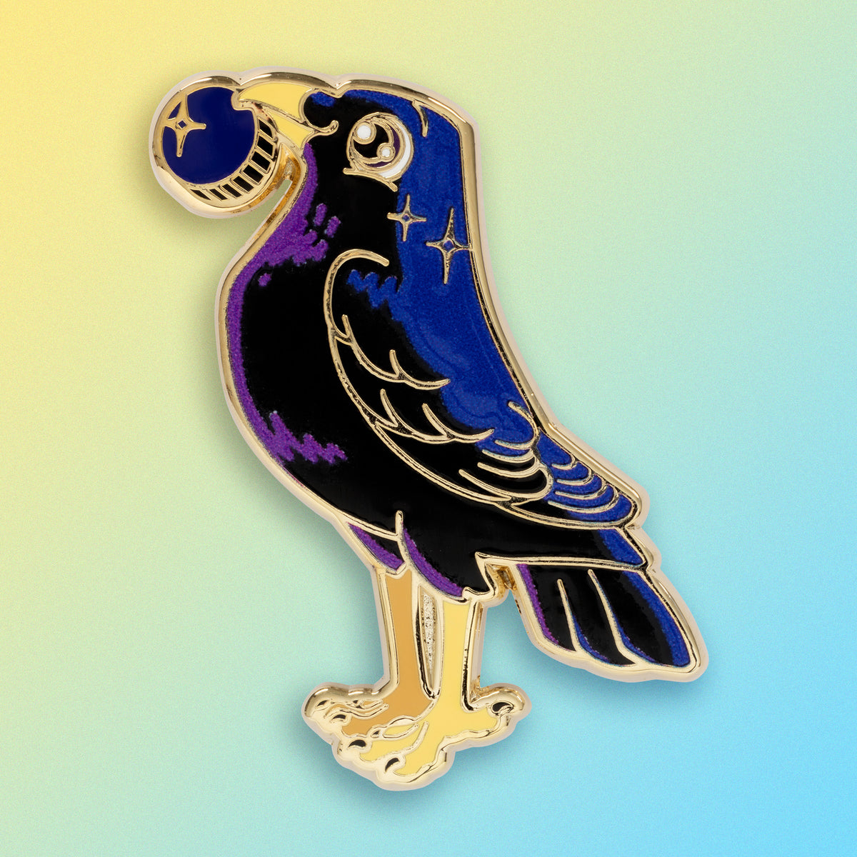 A gold-plated satin bowerbird hard enamel pin on a blue and yellow gradient background.