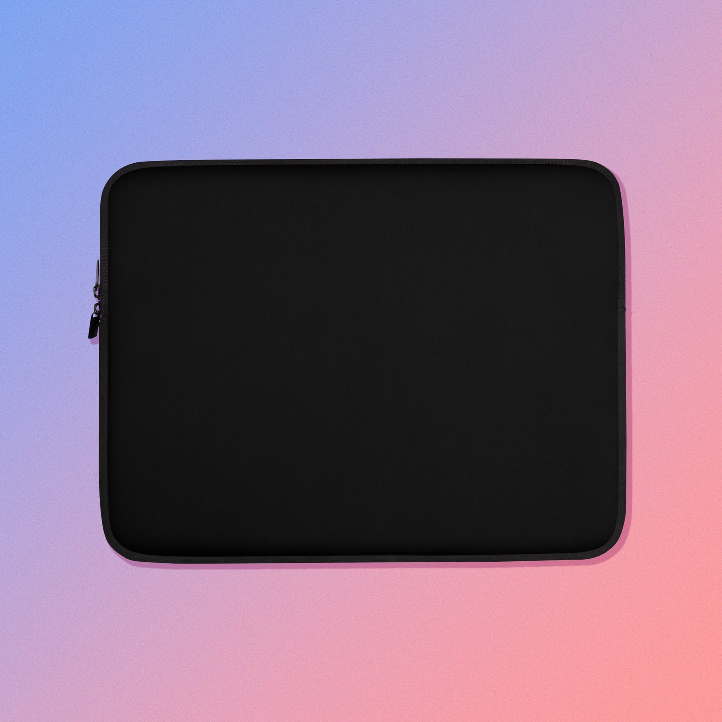 Laptop sleeve with plain black fabric on one side and a colourful green, red, blue and pink crimson rosella pattern on the other on a pink and blue gradient background.