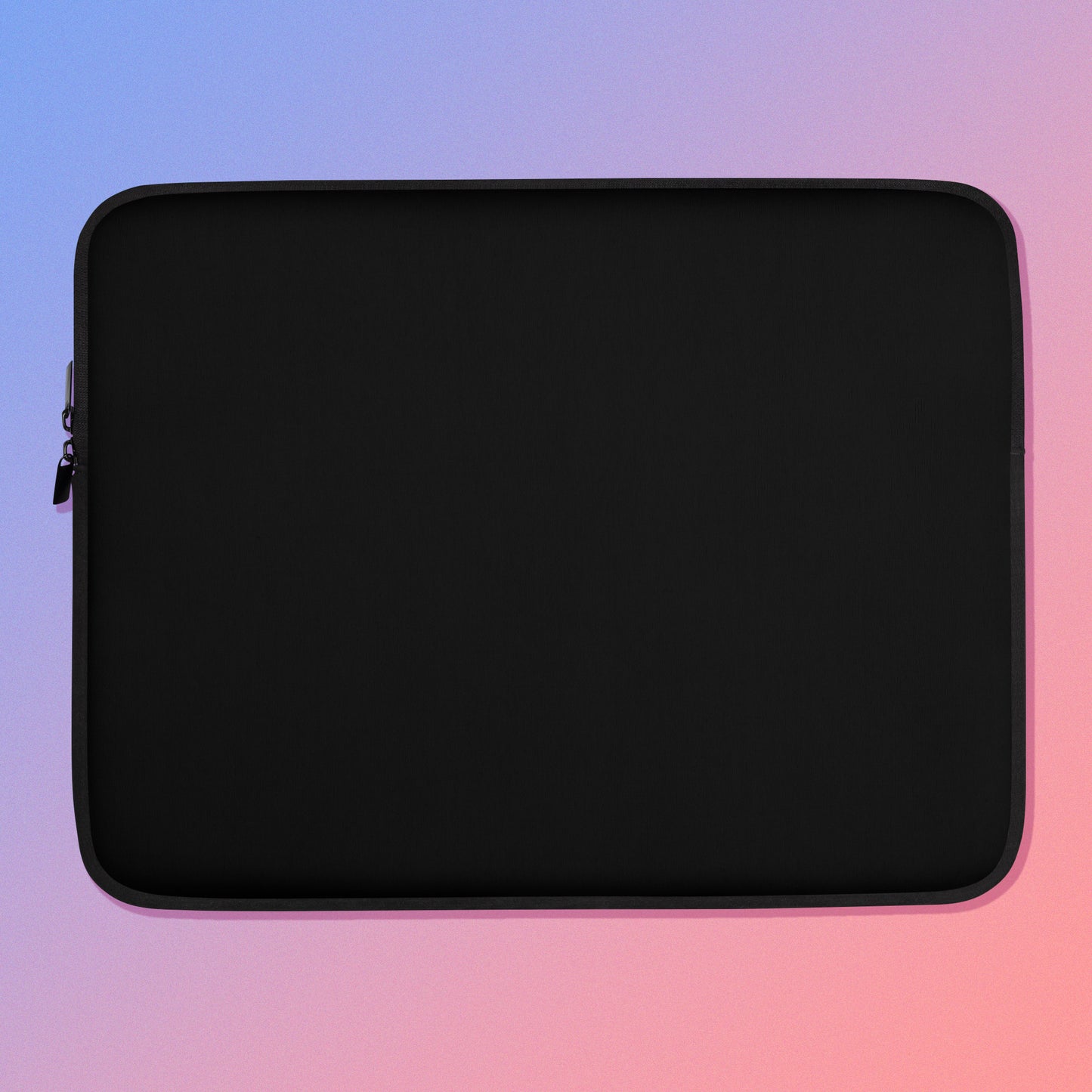 Laptop sleeve with plain black fabric on one side and a colourful green, red, blue and pink crimson rosella pattern on the other on a pink and blue gradient background.