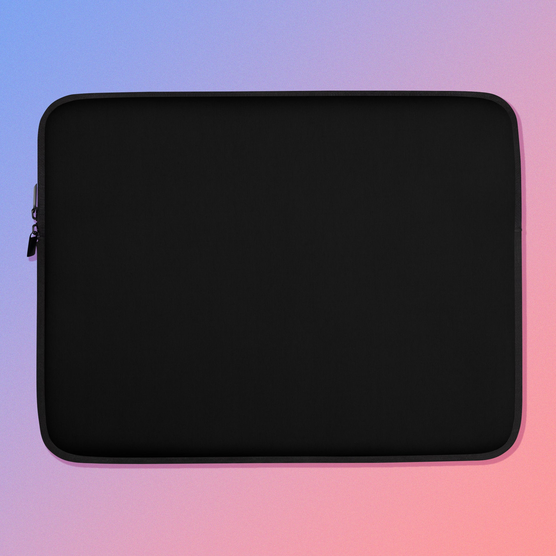 Laptop sleeve with plain black fabric on one side and a colourful green, red, blue and pink crimson rosella pattern on the other on a pink and blue gradient background.
