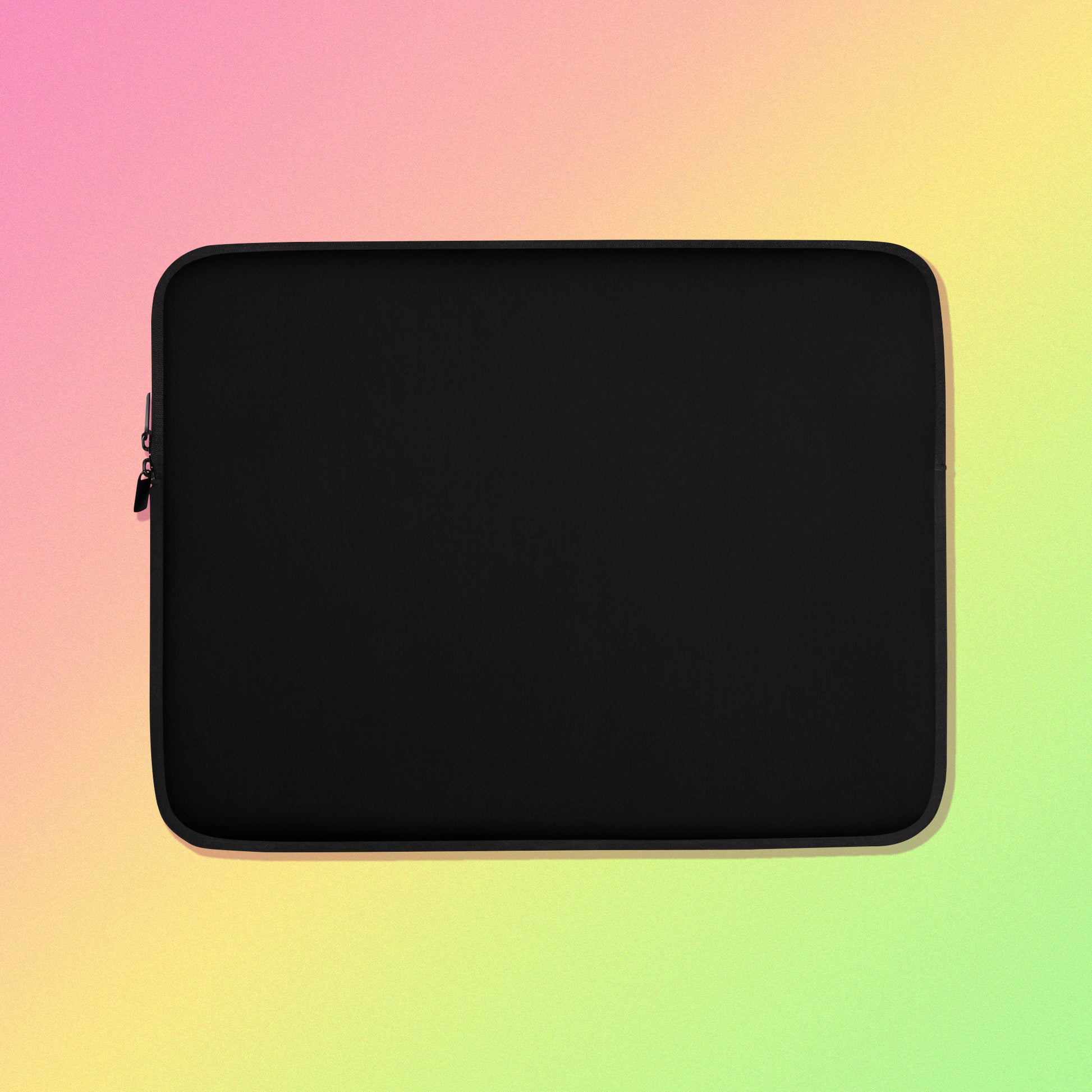 Laptop sleeve with plain black fabric on one side and a colourful rainbow, blue, green, red and pink Eastern Rosella pattern on the other on on a pink, yellow and green gradient background.