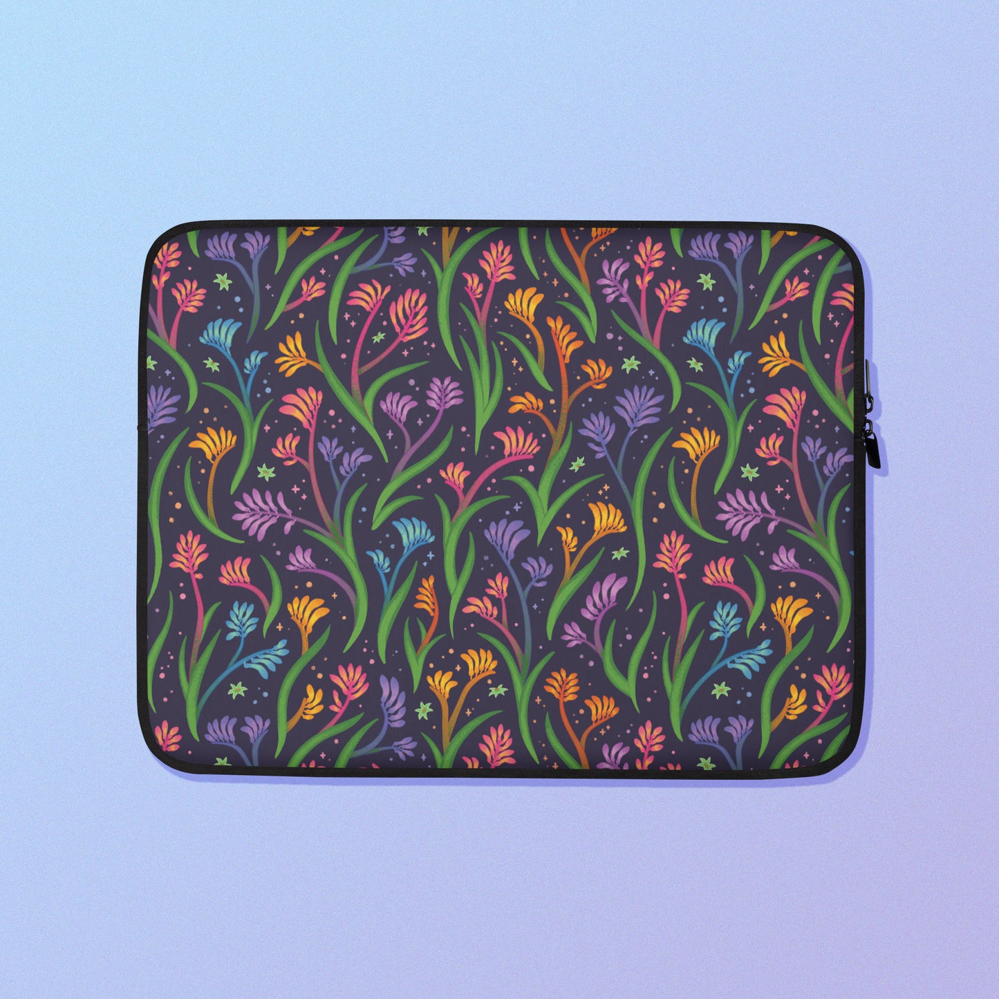 Laptop sleeve with a colourful rainbow kangaroo paw flower pattern on a blue and purple gradient background.
