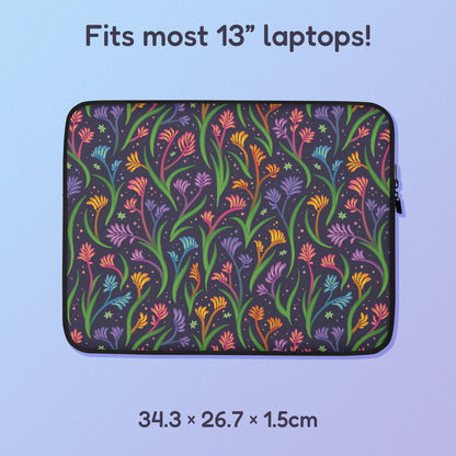 34.3 x 26.7 x 1.5cm 13" laptop sleeve with a colourful rainbow kangaroo paw flower pattern on a blue and purple gradient background.
