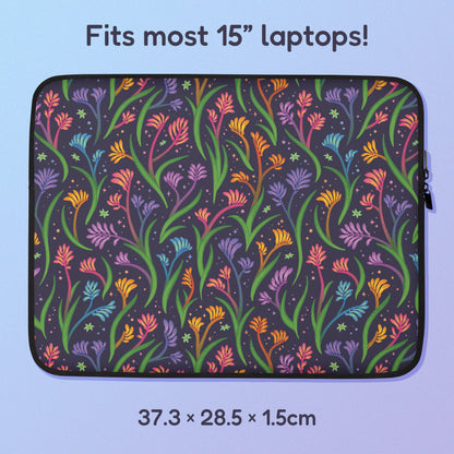 37.3 x 28.5 x 1.5cm 15" laptop sleeve with a colourful rainbow kangaroo paw flower pattern on a blue and purple gradient background.