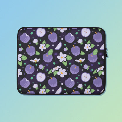 Laptop sleeve with a colourful purple apples and apple blossoms pattern on a blue and green gradient background.