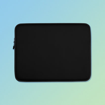 Laptop sleeve with plain black fabric on one side and a colourful purple apples and apple blossoms pattern on the other on a blue and green gradient background.