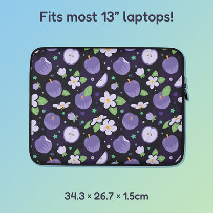34.3 x 26.7 x 1.5cm 13" laptop sleeve with a colourful purple apples and apple blossoms pattern on a blue and green gradient background.