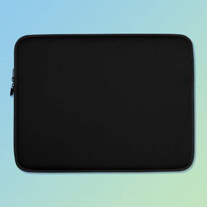 Laptop sleeve with plain black fabric on one side and a colourful purple apples and apple blossoms pattern on the other on a blue and green gradient background.